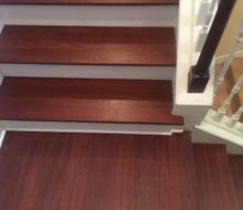 New Brazilian Cherry stair treads - custom stained and installed with new wood flooring on landing