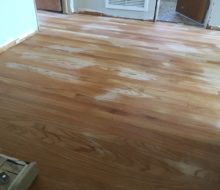 water "popped" solid red oak flooring