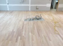 Sanded peeled Red Oak floor with weave-in repair