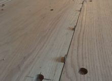 Installing drilled red oak planks with nickels for expansion
