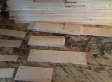 Some varied width red oak plank flooring drilled for walnut pegs