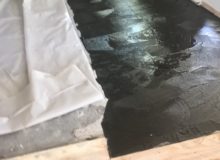 Installing vapor membrane on concrete slab