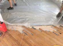 Installing vapor membrane on concrete slab