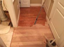 Applying sealer to American Cherry flooring