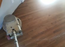 Buffing repaired, refinished red oak flooring
