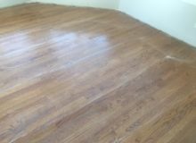 Buffing repaired, refinished red oak flooring