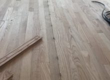 Nickels installed for solid red oak wood flooring expansion joints