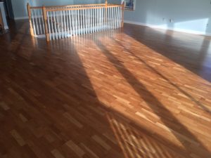 Repaired, sanded, and refinished white oak flooring