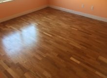 Repaired, sanded, and refinished white oak flooring