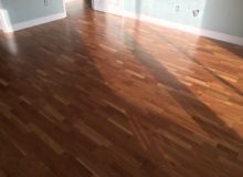 Repaired, sanded, and refinished white oak flooring