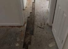 Removing old, water damaged Red Oak wood flooring