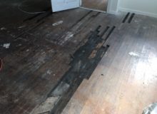 Removing old, water damaged Red Oak wood flooring