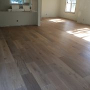 Installed wire brushed white oak wood flooring