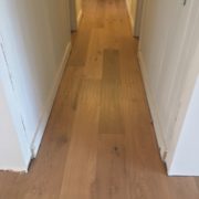 Installed wire brushed white oak wood flooring