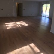 Installed wire brushed white oak wood flooring