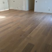 Installed wire brushed white oak wood flooring