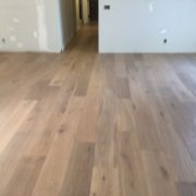 Installed wire brushed white oak wood flooring