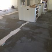 Leveling the concrete slab subfloor