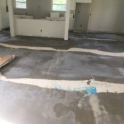 Leveling the concrete slab subfloor