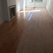 Applying sealer to solid red oak flooring