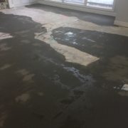 Leveling concrete slab subfloor