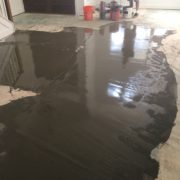 Leveling concrete slab subfloor