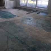 Leveling concrete slab subfloor