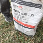 Concrete slab leveling underlayment material