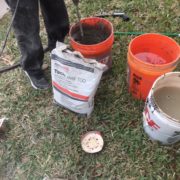 Mixing concrete slab leveling underlayment material