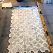 Stone basket weave inlay for bathroom remodel project