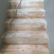 Sanding and hand scraping stairway