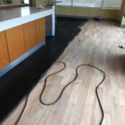 Applying ebony stain - bar wood floor - Matthew's Restaurant