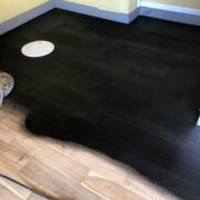 Applying ebony stain - bar wood floor - Matthew's Restaurant