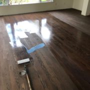 Applying sealer to Red Oak flooring