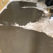 Leveling concrete slab subfloor