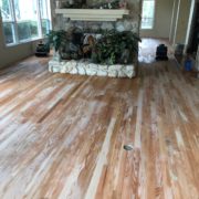 Popping grain of sanded Red Oak flooring