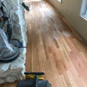 Popping grain of sanded Red Oak flooring