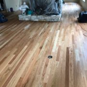 Popping grain of sanded Red Oak flooring