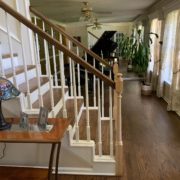 Stained, finished Red Oak floor, stair treads and rail