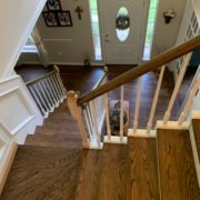 Stained, finished Red Oak floor, stair treads and rail