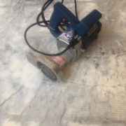 grinder used in leveling slab for wood flooring installation