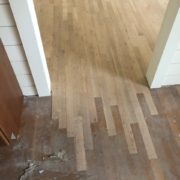 Weave in unfinished white oak flooring at doorway