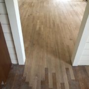 Weave in unfinished white oak flooring at doorway and installation