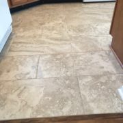 Caribbean rosewood transition to Emser porcelain kitchen floor tile