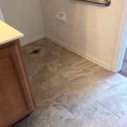 Emser porcelain floor tile installed in one of the bathrooms
