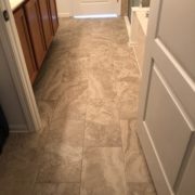 Emser porcelain floor tile installed in one of the bathrooms