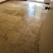 Existing tile floor, prior to diamond grinder leveling