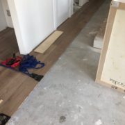 Installing engineered White Oak hardwood flooring.