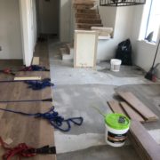 Installing engineered White Oak hardwood flooring.