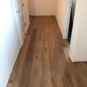 Installing engineered White Oak hardwood flooring.